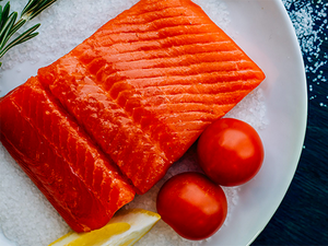 plated salmon filet with tomatoes